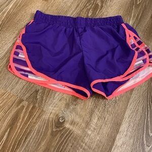 Pink and purple Small Tek Gear running shorts.